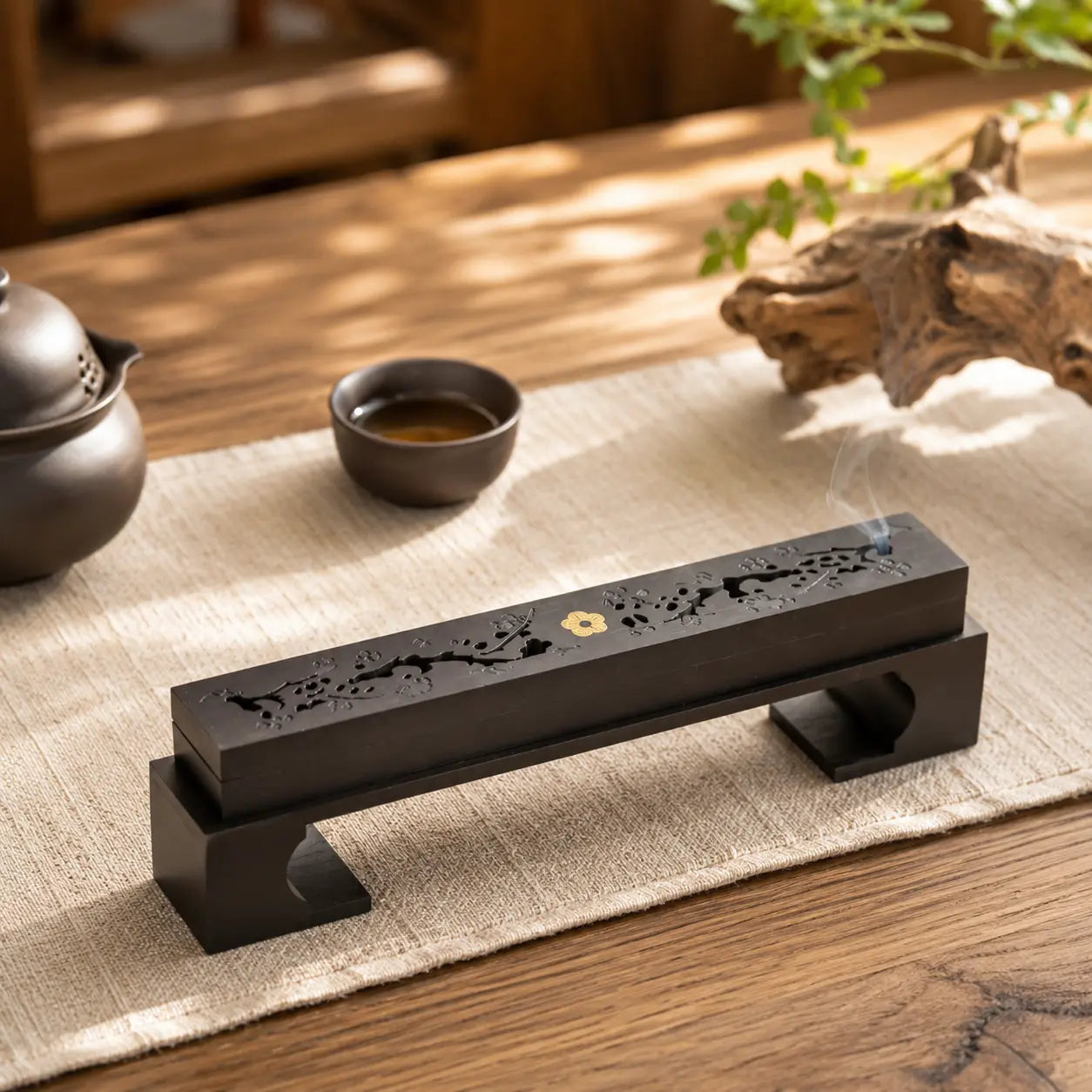 Ebony incense box displayed with natural incense sticks for a mindful home ritual