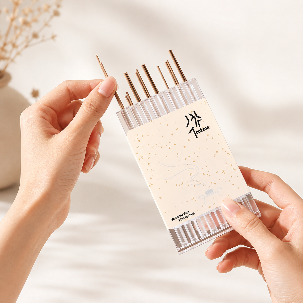 Toukson Focus Series Discovery Set held by hand, showing bamboo-free pure incense sticks