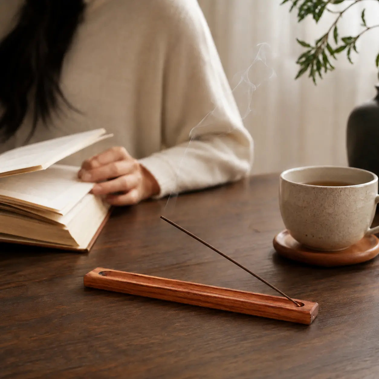 Rosewood incense holder displayed in a cozy home setting for mindful relaxation