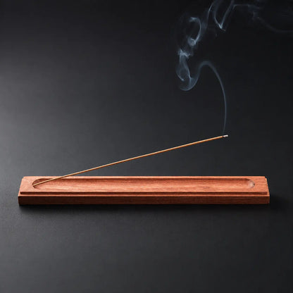 Rosewood incense holder with burning incense stick for peaceful aromatherapy rituals